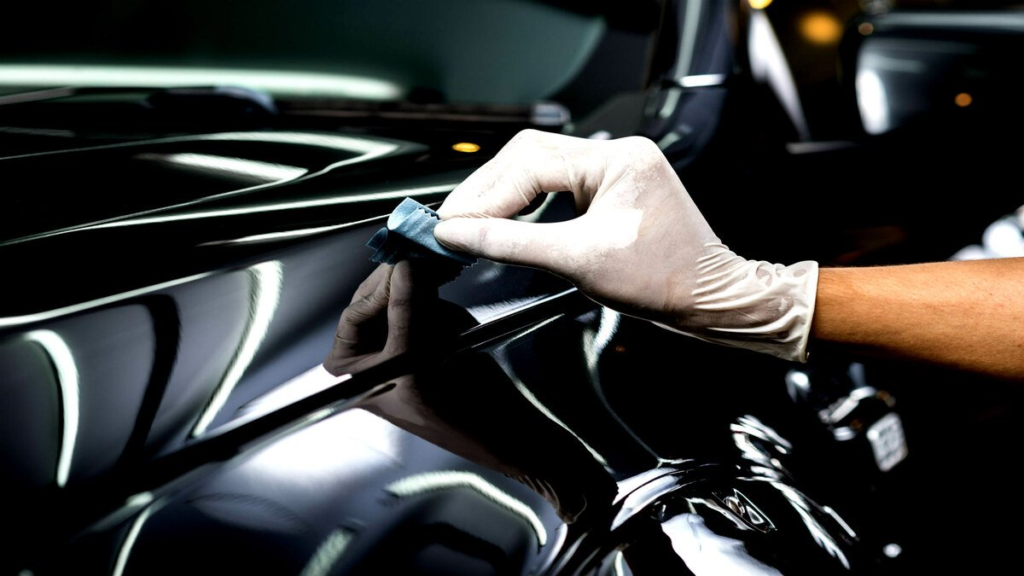 A man doing interior car detailing